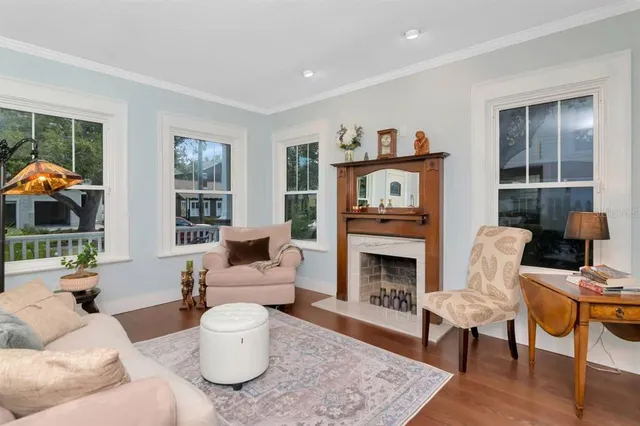 a living room with furniture and a fireplace
