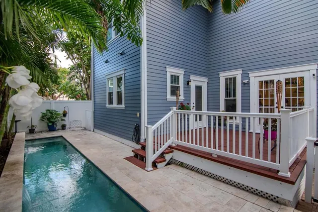 a view of a house with wooden floor and a yard