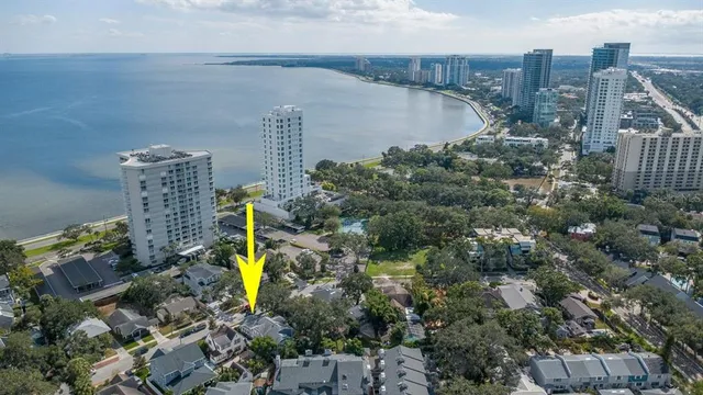 a bird view of building and lake
