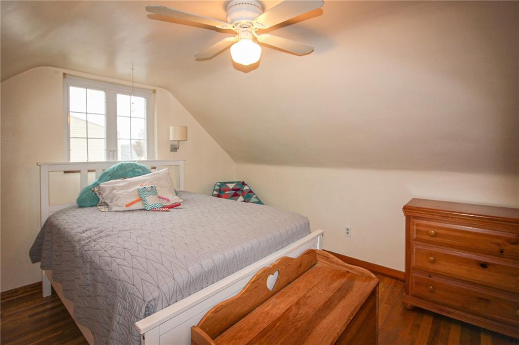 164 Gill Hall Road Clairton, PA 15025 - Photo 17 of 30 a bedroom with a bed and a chandelier