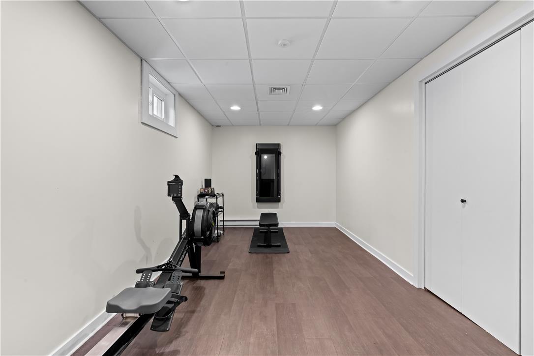 1506 Pleasant View Road Coopersburg, PA 18036 - Photo 74 of 97 Well-lit exercise room featuring durable flooring and convenient storage space.
