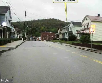 a view of a street with a building in the background