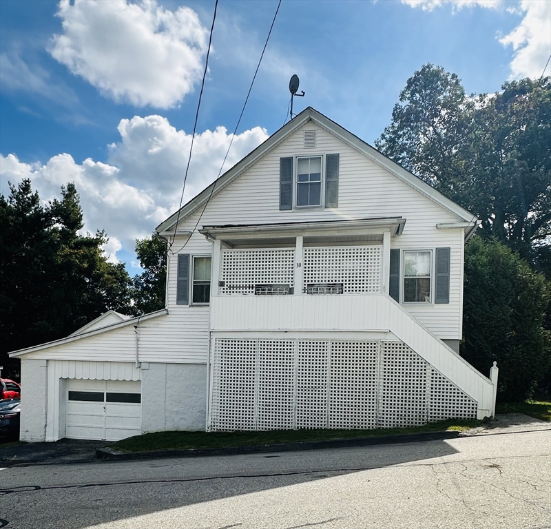 a front view of a house with a garage
