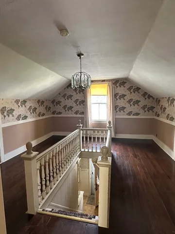 a view of a livingroom with a ceiling fan and window