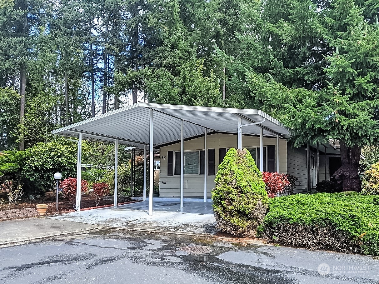 201 Union Avenue Southeast, Unit 45 Renton, WA 98059 - Photo 1 of 29 a view of a house with a yard and potted plants