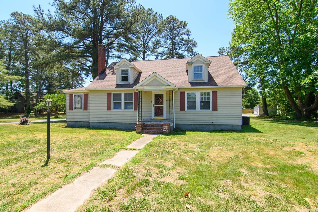 24432 Maxwell Street Parksley, VA 23421 - Photo 2 of 39 a house with trees in the background