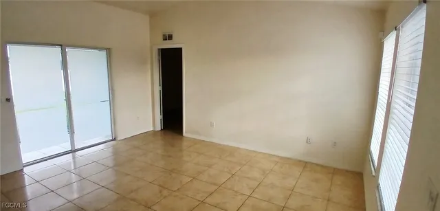 a view of an empty room and window