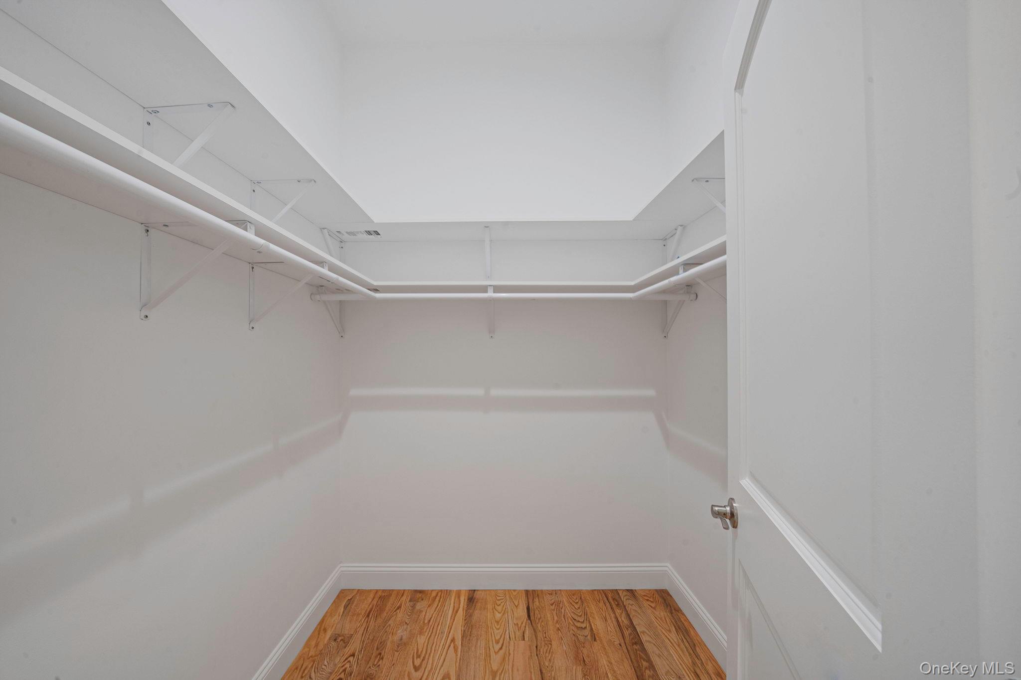 64 Blydenburgh Road Centereach, NY 11720 - Photo 13 of 29 a view of room with racks on the wall