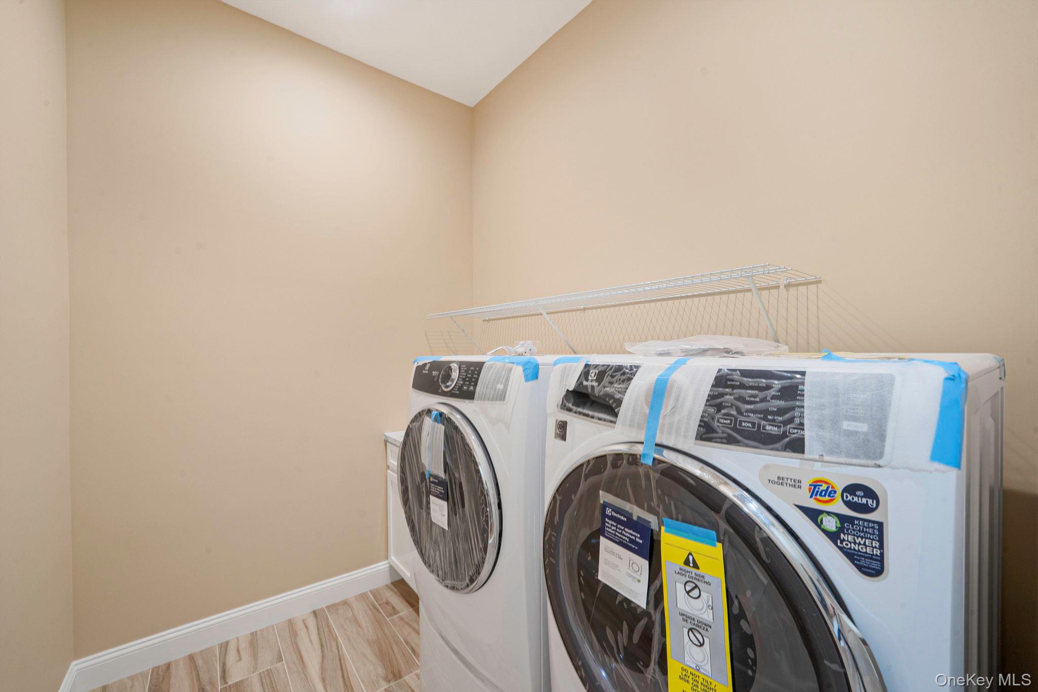 64 Blydenburgh Road Centereach, NY 11720 - Photo 20 of 29 a utility room with dryer and washer