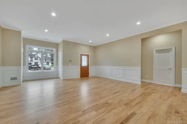 a view of an empty room and a window