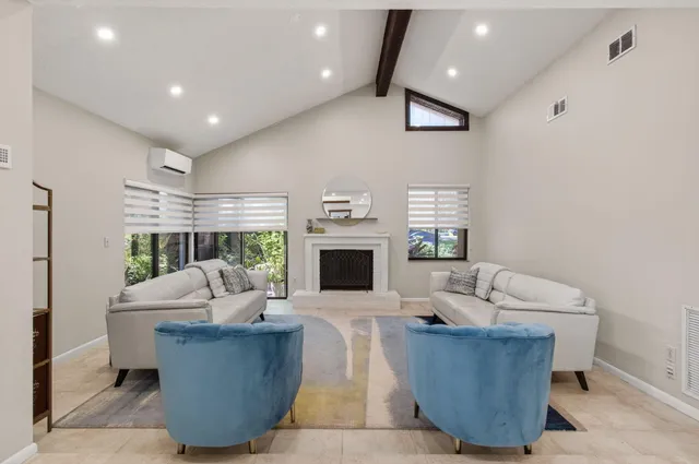 a kitchen with stainless steel appliances granite countertop a sink and refrigerator