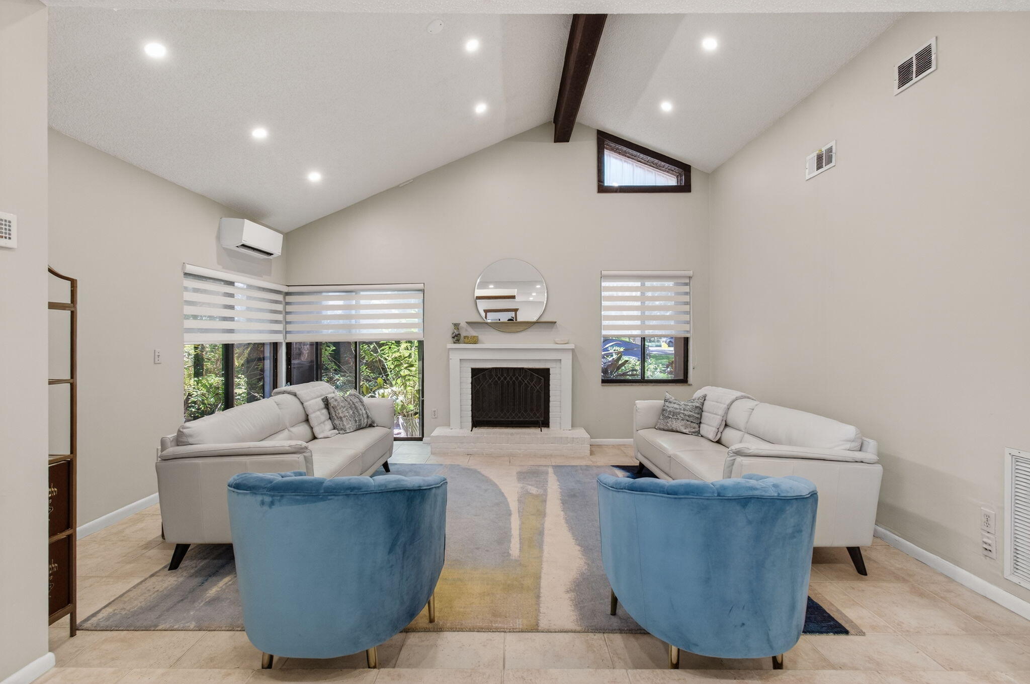 7745 Stanway Place Boca Raton, FL 33433 - Photo 12 of 90 a living room with furniture a fireplace and a large window