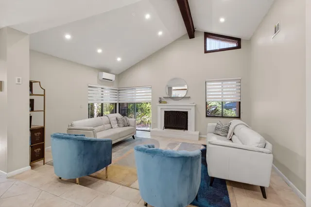 a kitchen with stainless steel appliances granite countertop a sink and dishwasher a stove top oven with wooden floor