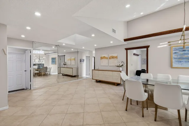 a bedroom with a bed wooden floor and window