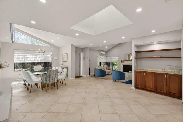 a bedroom with two beds and a chandelier