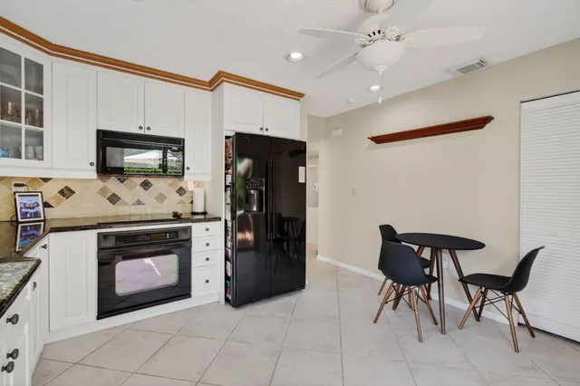 a room with two chair and wooden floor