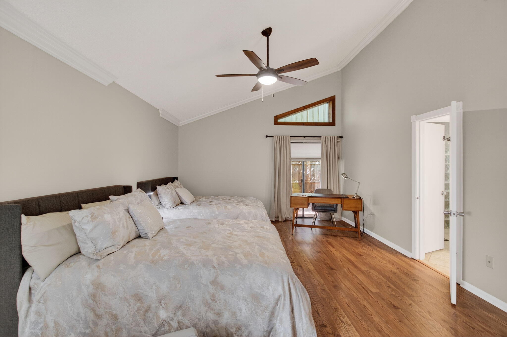 7745 Stanway Place Boca Raton, FL 33433 - Photo 33 of 90 a bedroom with a large bed and a chandelier