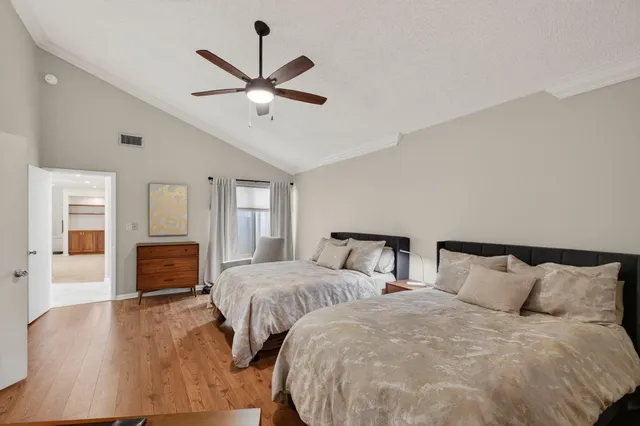 an aerial view of a house with yard and swimming pool