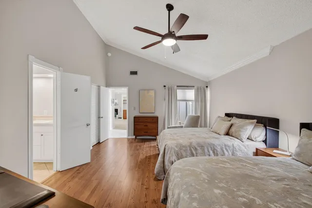 an aerial view of multiple houses with yard