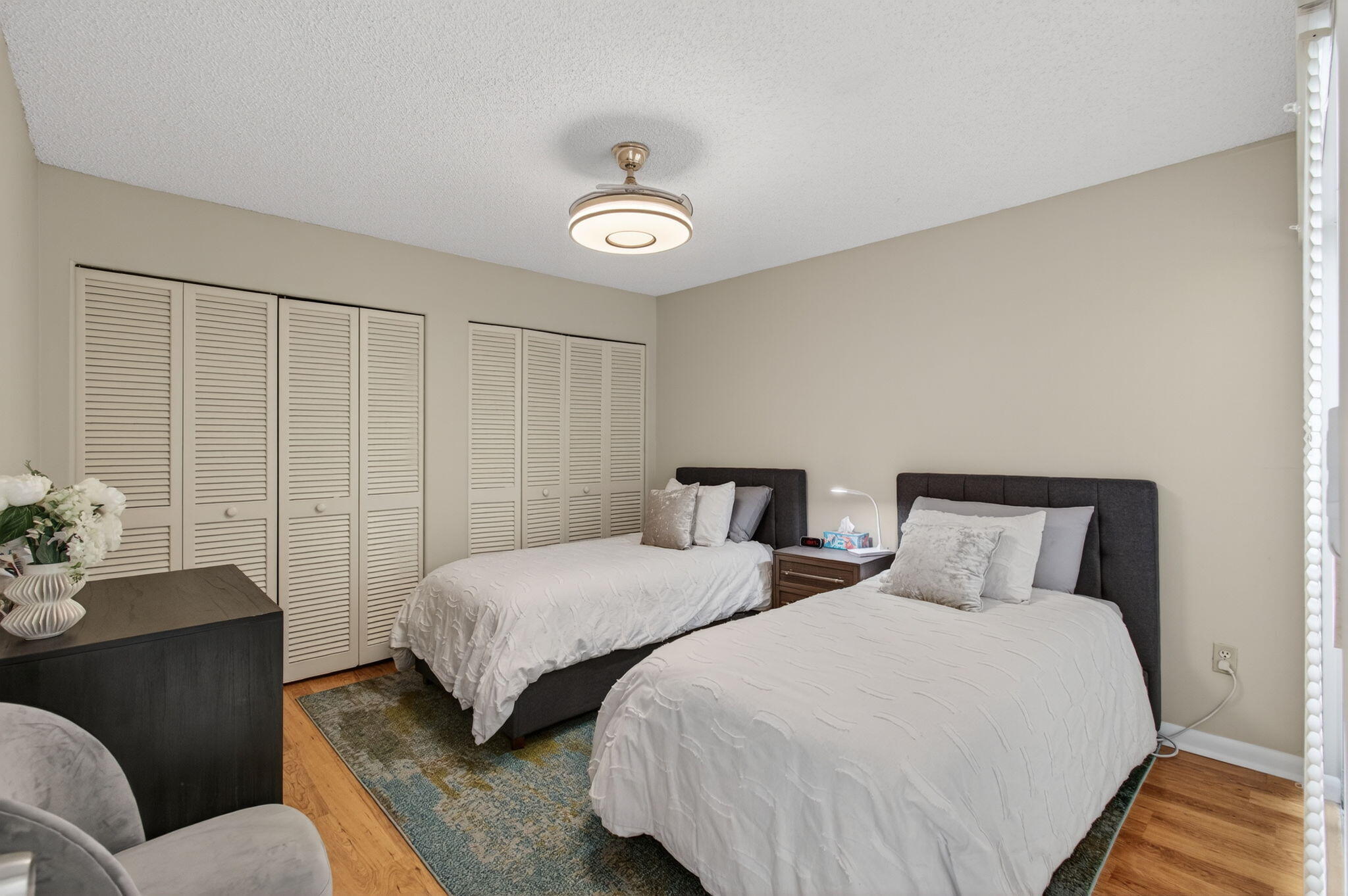 7745 Stanway Place Boca Raton, FL 33433 - Photo 41 of 90 a bedroom with two beds and a chandelier