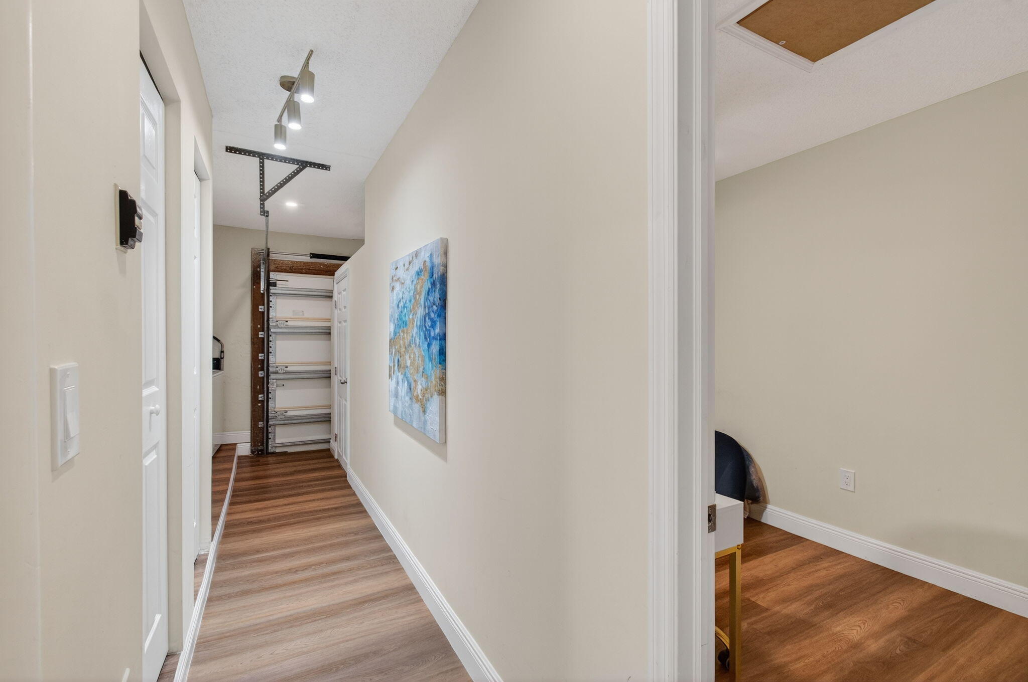 7745 Stanway Place Boca Raton, FL 33433 - Photo 52 of 90 a view of a hallway with wooden floor and staircase