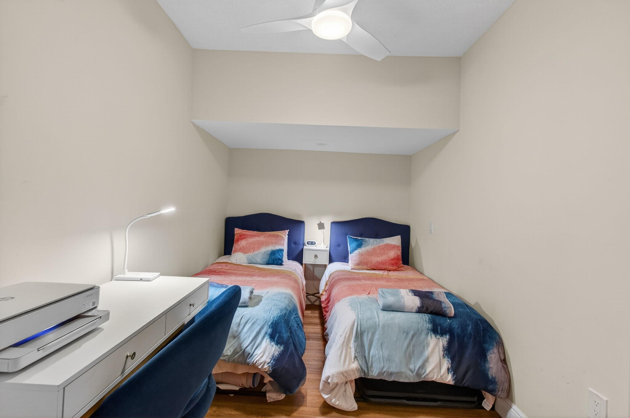 7745 Stanway Place Boca Raton, FL 33433 - Photo 54 of 90 a bedroom with two beds and a lamp on a dresser