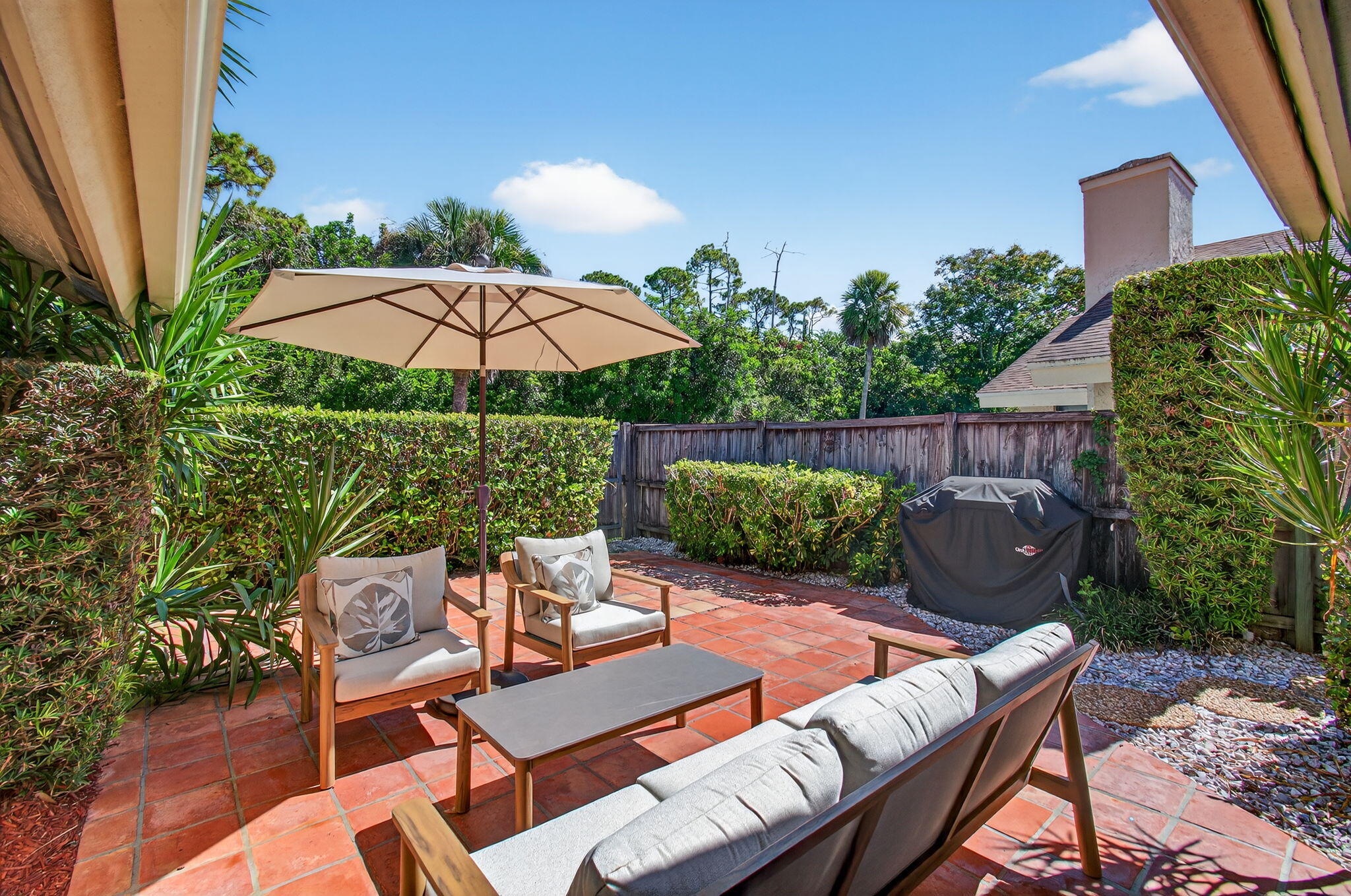 7745 Stanway Place Boca Raton, FL 33433 - Photo 65 of 90 a view of a patio with furniture and table under an umbrella