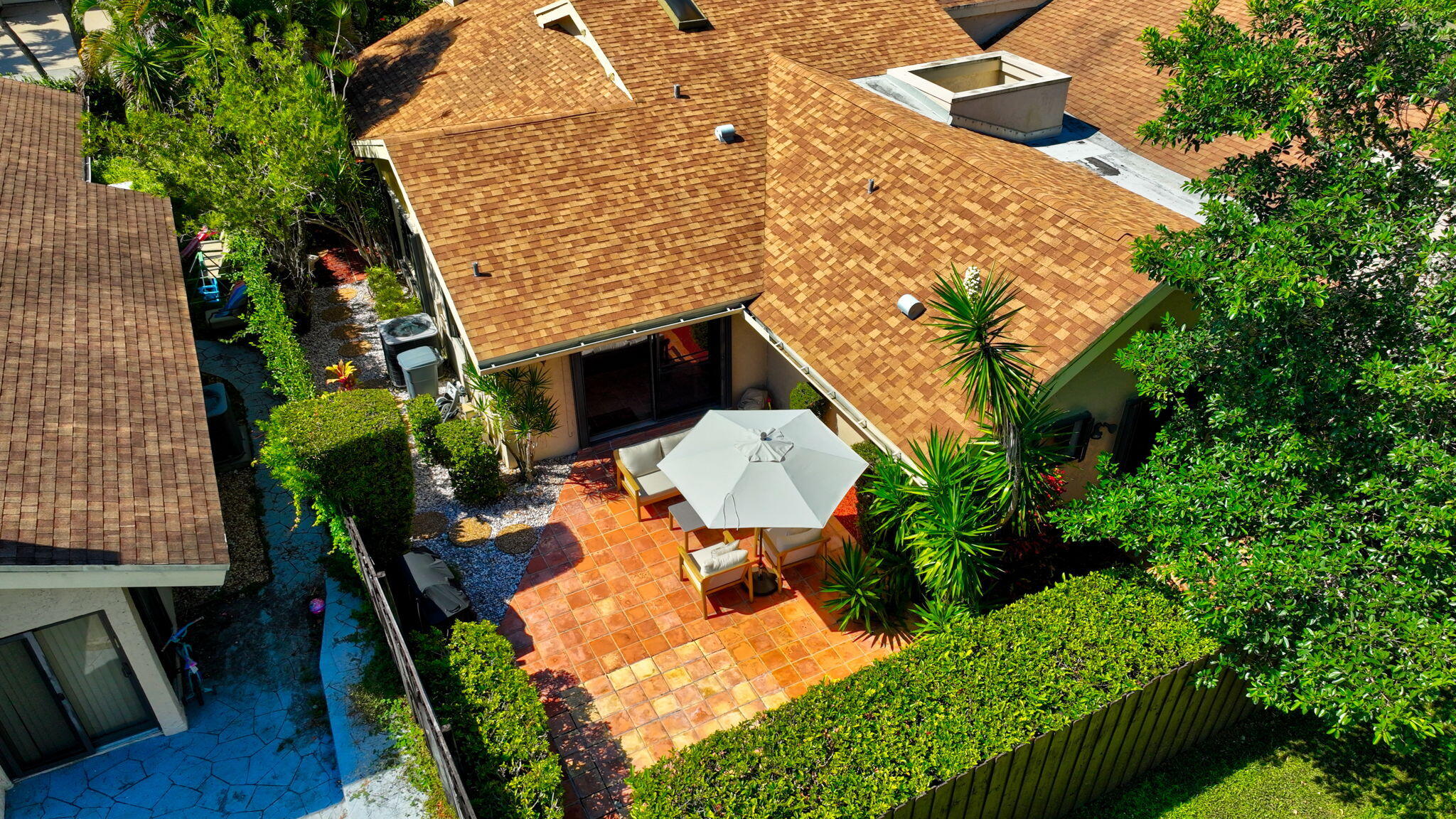 7745 Stanway Place Boca Raton, FL 33433 - Photo 85 of 90 an aerial view of a house with table and chairs and potted plants