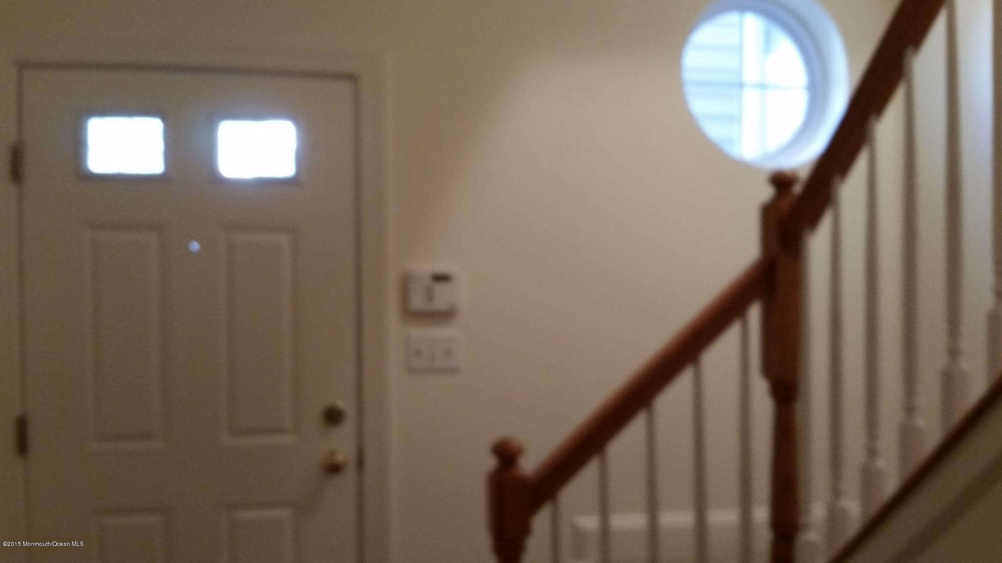 902 Abby Road Middletown, NJ 07748 - Photo 11 of 61 a view of a hallway with wooden floor and entryway