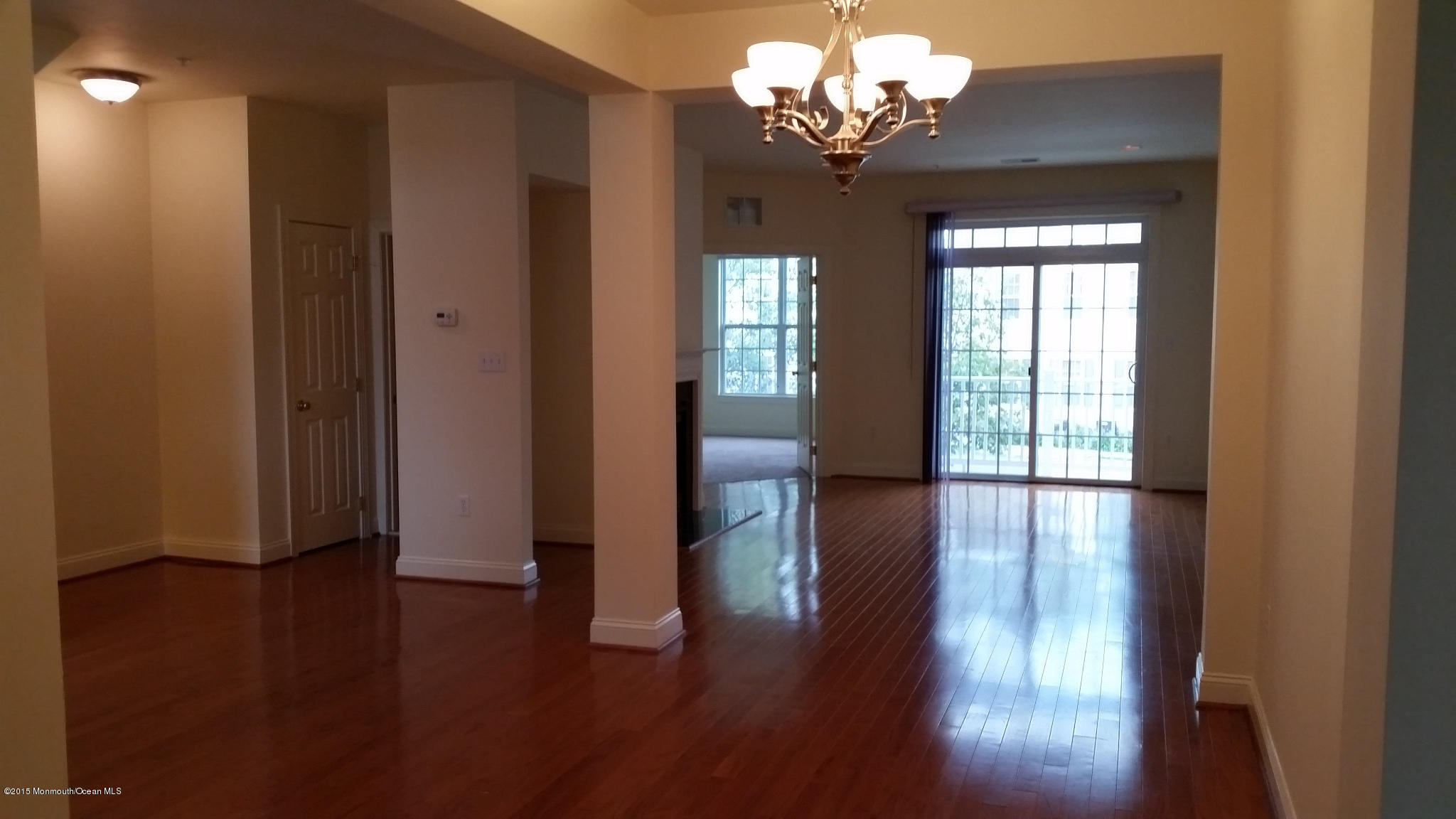 902 Abby Road Middletown, NJ 07748 - Photo 14 of 61 a view of a livingroom with hardwood floor and a ceiling fan
