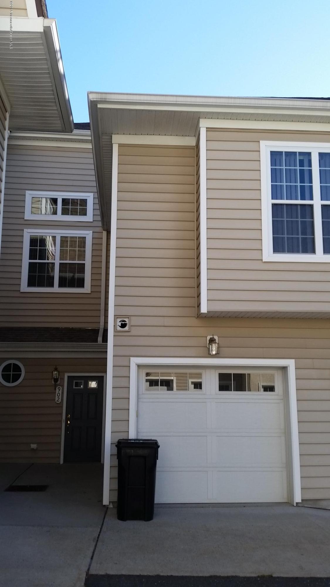 902 Abby Road Middletown, NJ 07748 - Photo 3 of 61 a front view of a house with a garage