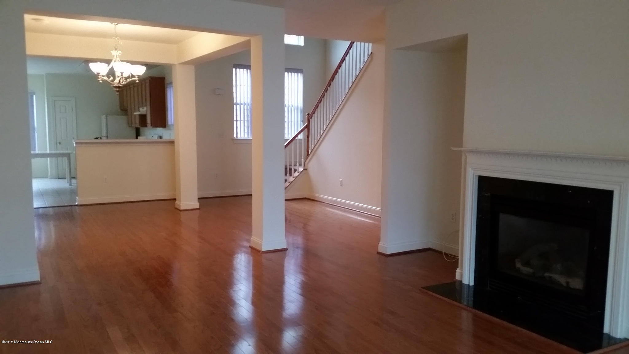902 Abby Road Middletown, NJ 07748 - Photo 33 of 61 a view of a livingroom with wooden floor and a fireplace