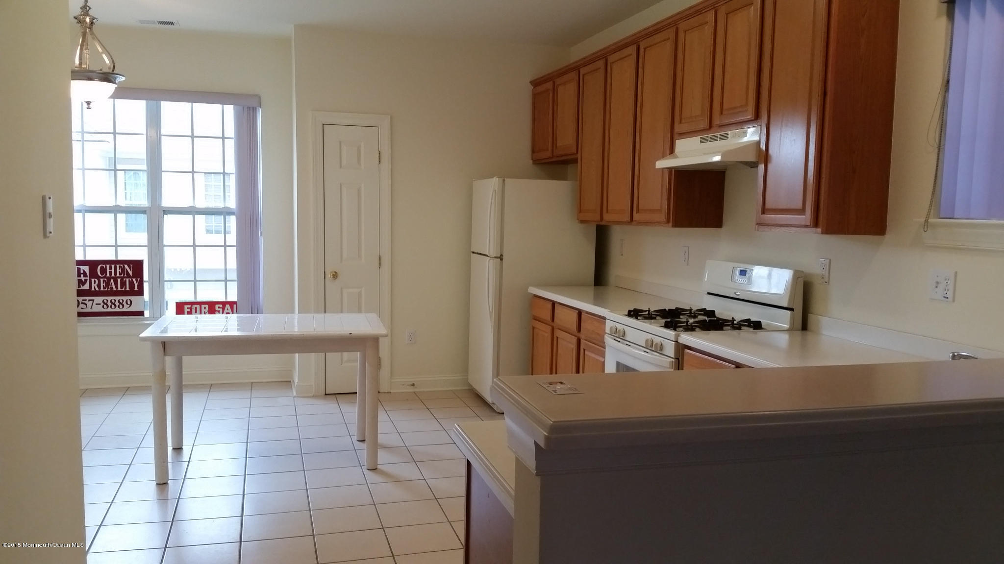 902 Abby Road Middletown, NJ 07748 - Photo 36 of 61 a kitchen with a sink a stove and a microwave