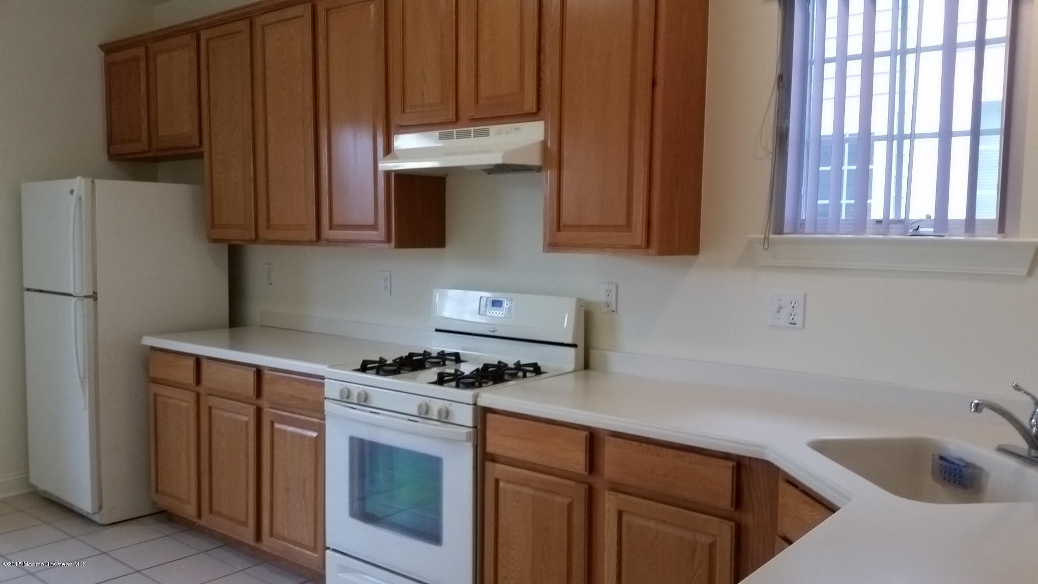 902 Abby Road Middletown, NJ 07748 - Photo 40 of 61 a kitchen with stainless steel appliances granite countertop a refrigerator stove and sink