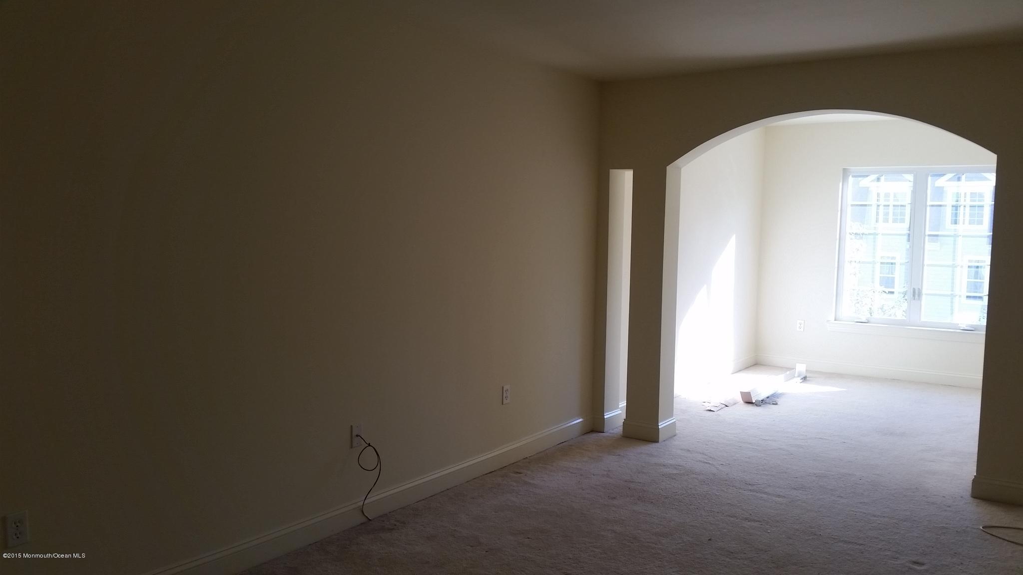 902 Abby Road Middletown, NJ 07748 - Photo 50 of 61 an empty room with a empty space and windows