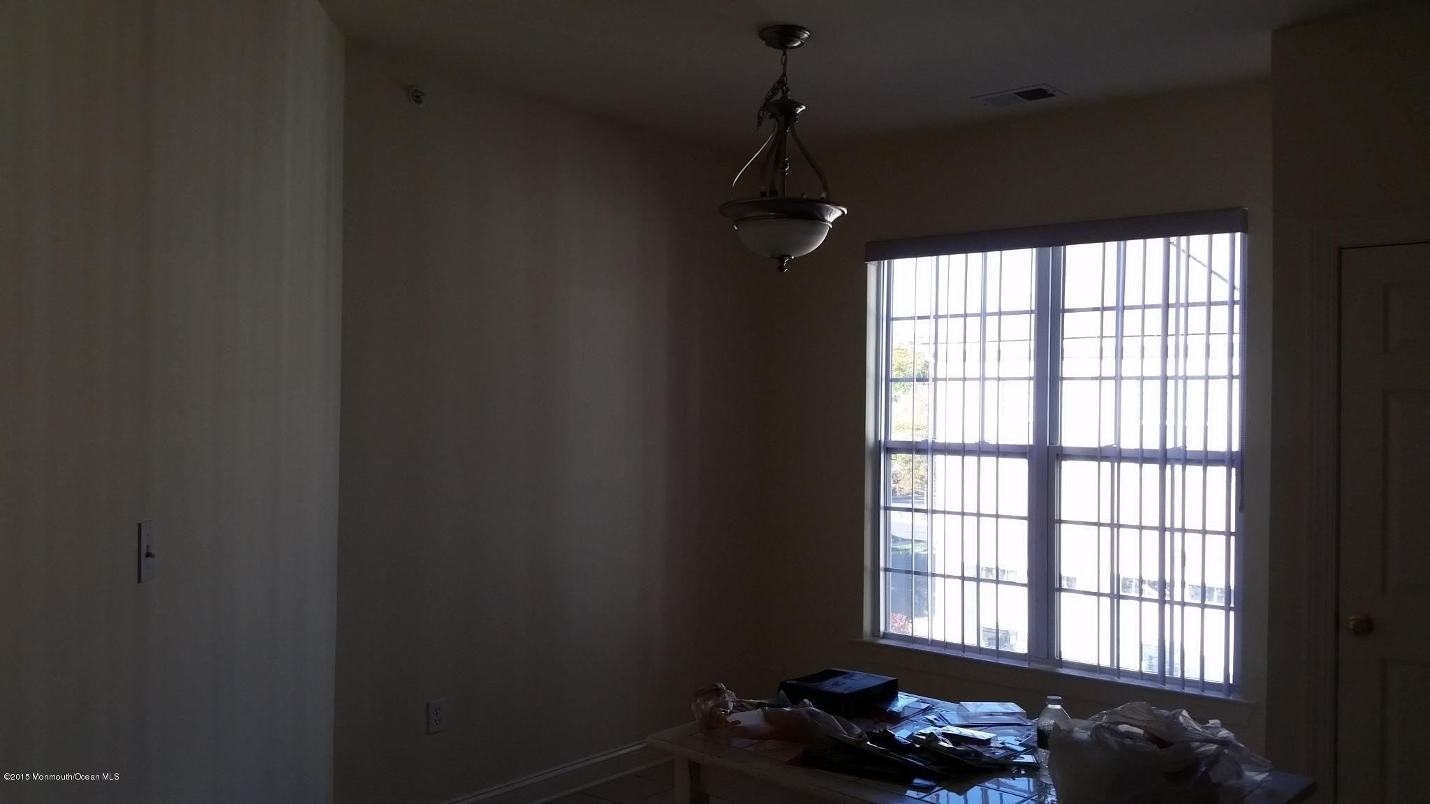 902 Abby Road Middletown, NJ 07748 - Photo 52 of 61 a living room with furniture and a window