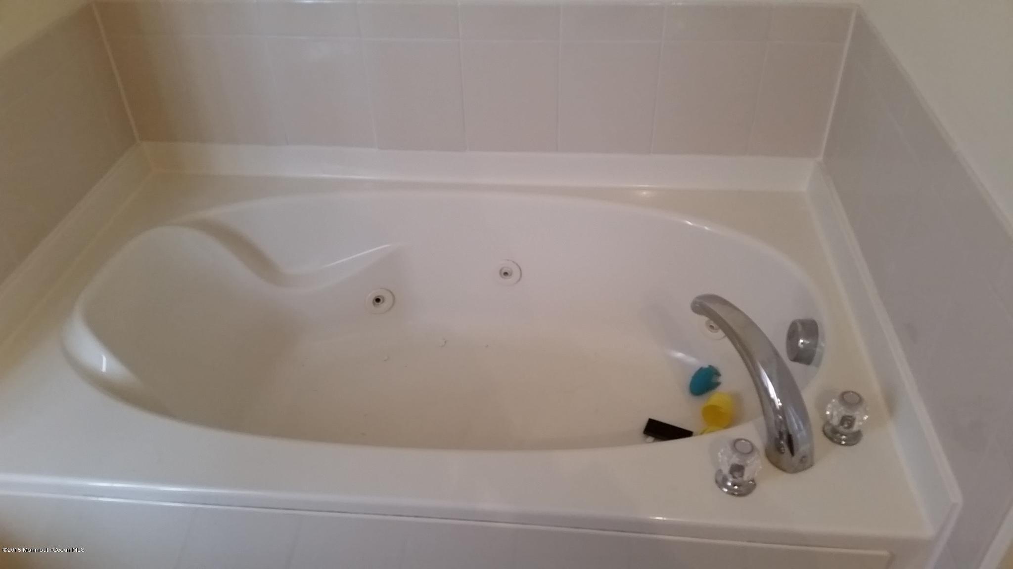 902 Abby Road Middletown, NJ 07748 - Photo 56 of 61 a bathroom with a bathtub