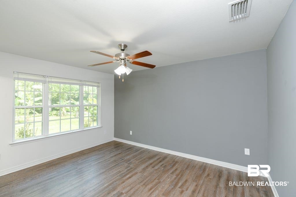 12641 Pecan Street Grand Bay, AL 36541 - Photo 13 of 23 Unfurnished room featuring ceiling fan and hardwood / wood-style floors