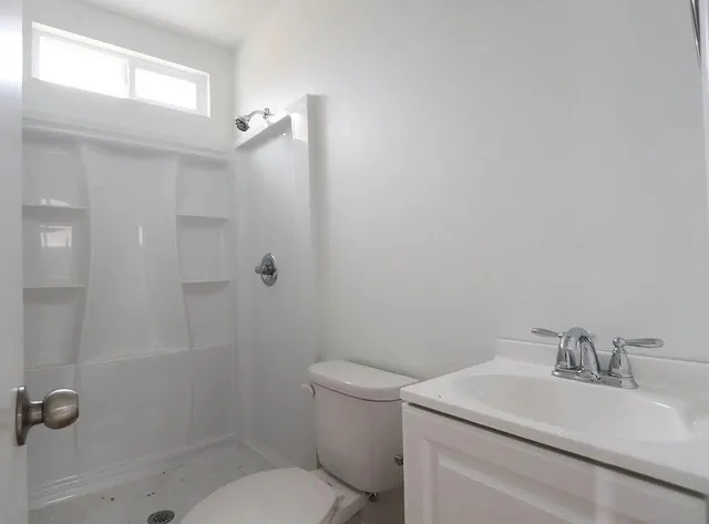 a view of a house with a sink and table in the patio