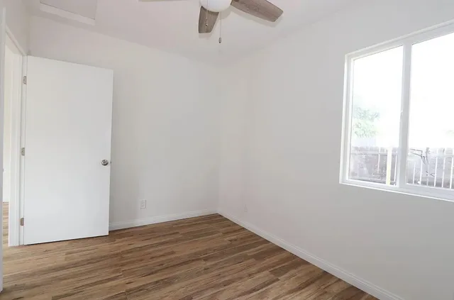 a bathroom with a toilet sink vanity and shower