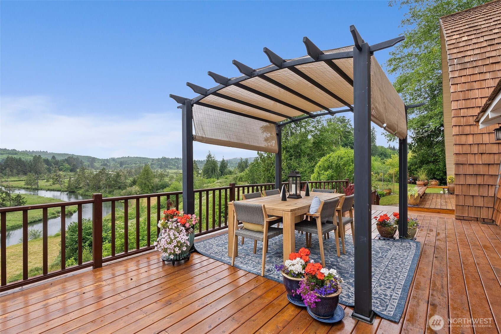 1508 Bloomhardt Road Raymond, WA 98577 - Photo 12 of 40 a view of balcony with chairs and wooden floor