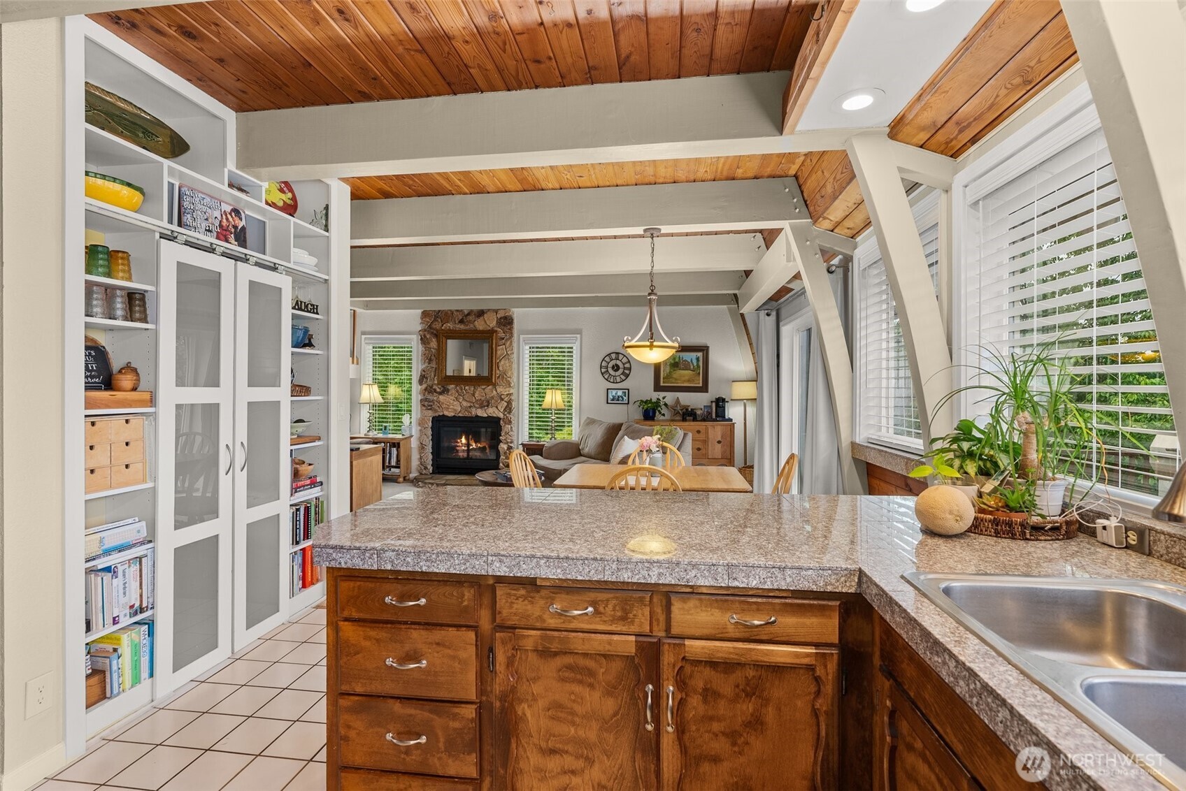 1508 Bloomhardt Road Raymond, WA 98577 - Photo 16 of 40 a kitchen with a sink and a refrigerator