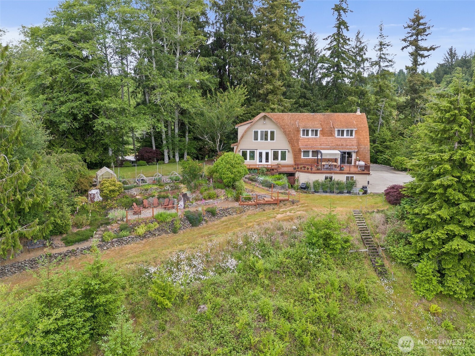 1508 Bloomhardt Road Raymond, WA 98577 - Photo 2 of 40 a view of a house with a yard and sitting area