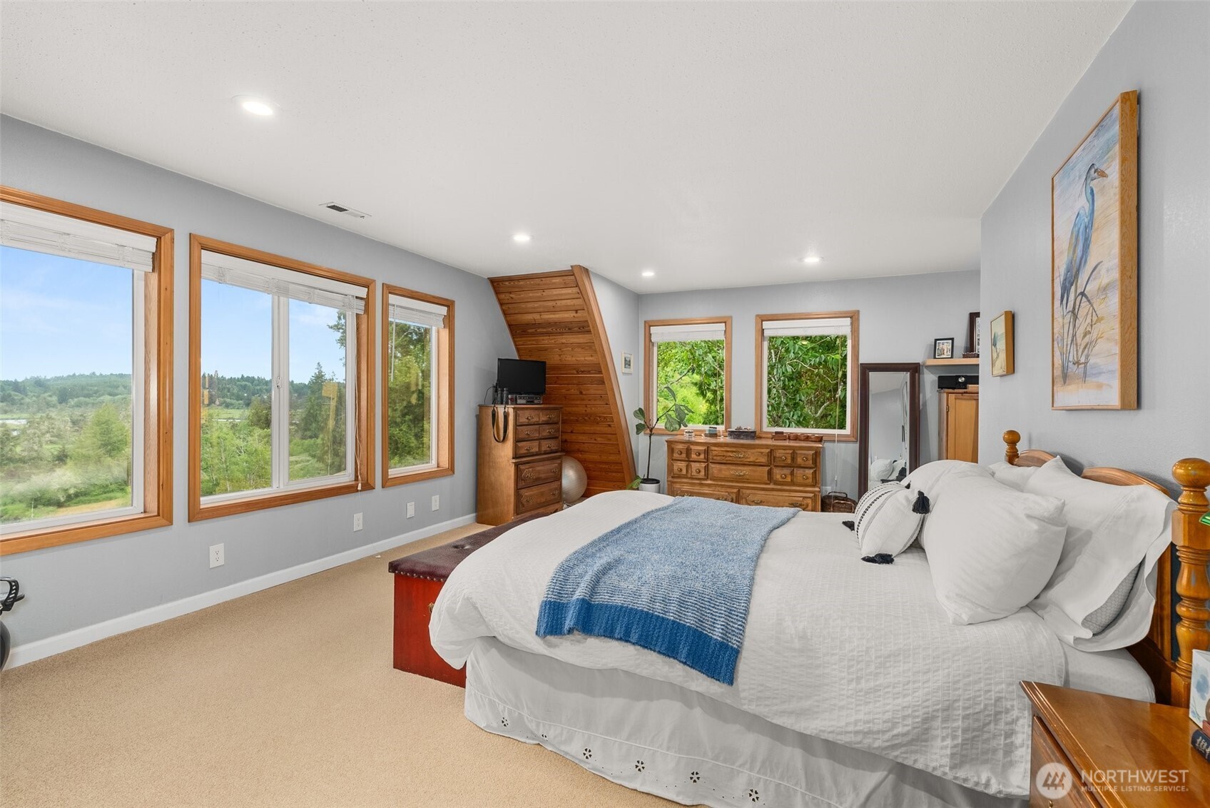 1508 Bloomhardt Road Raymond, WA 98577 - Photo 24 of 40 a bedroom with a large bed and a large window