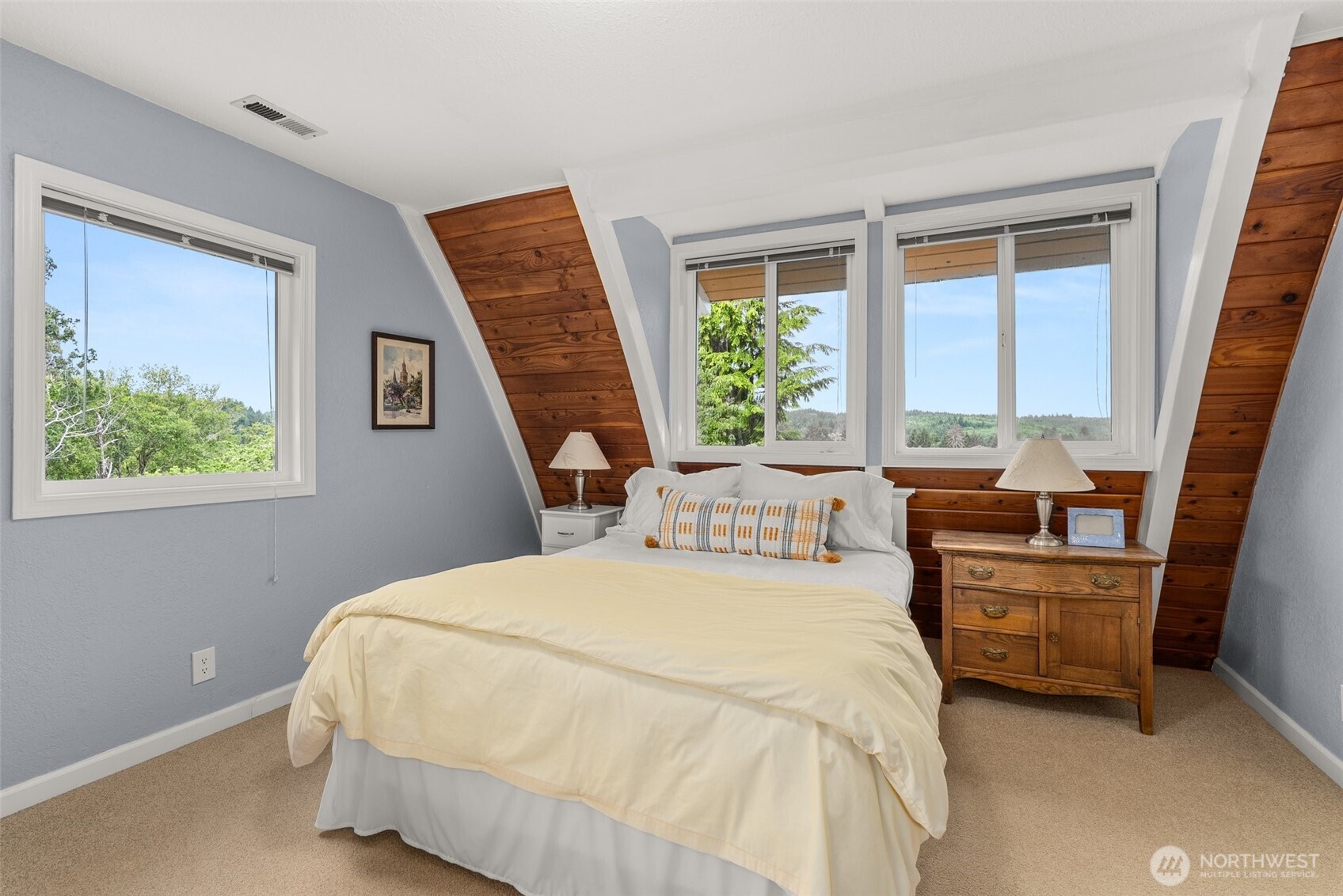 1508 Bloomhardt Road Raymond, WA 98577 - Photo 27 of 40 a bedroom with a bed wooden floor and window