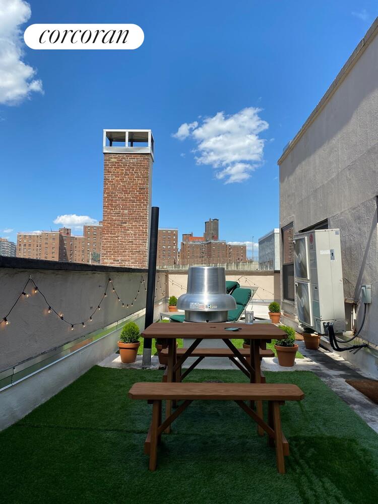 264 Water Street, Unit PHD Manhattan, NY 10038 - Photo 11 of 13 a view of a terrace with sitting area