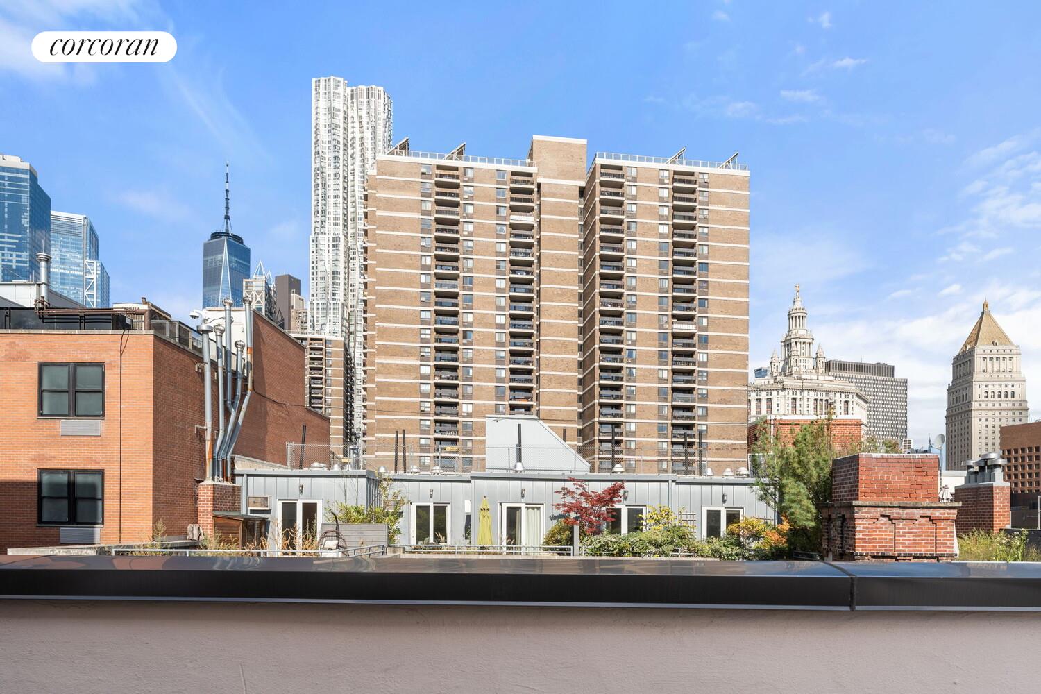 264 Water Street, Unit PHD Manhattan, NY 10038 - Photo 12 of 13 a front view of a building with glass windows