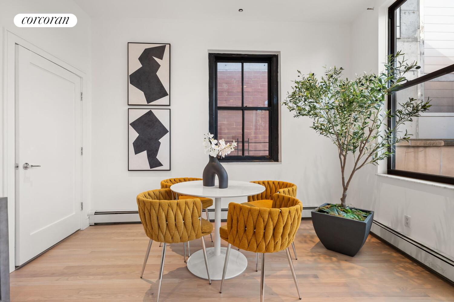 264 Water Street, Unit PHD Manhattan, NY 10038 - Photo 2 of 13 a living room with furniture and a potted plant