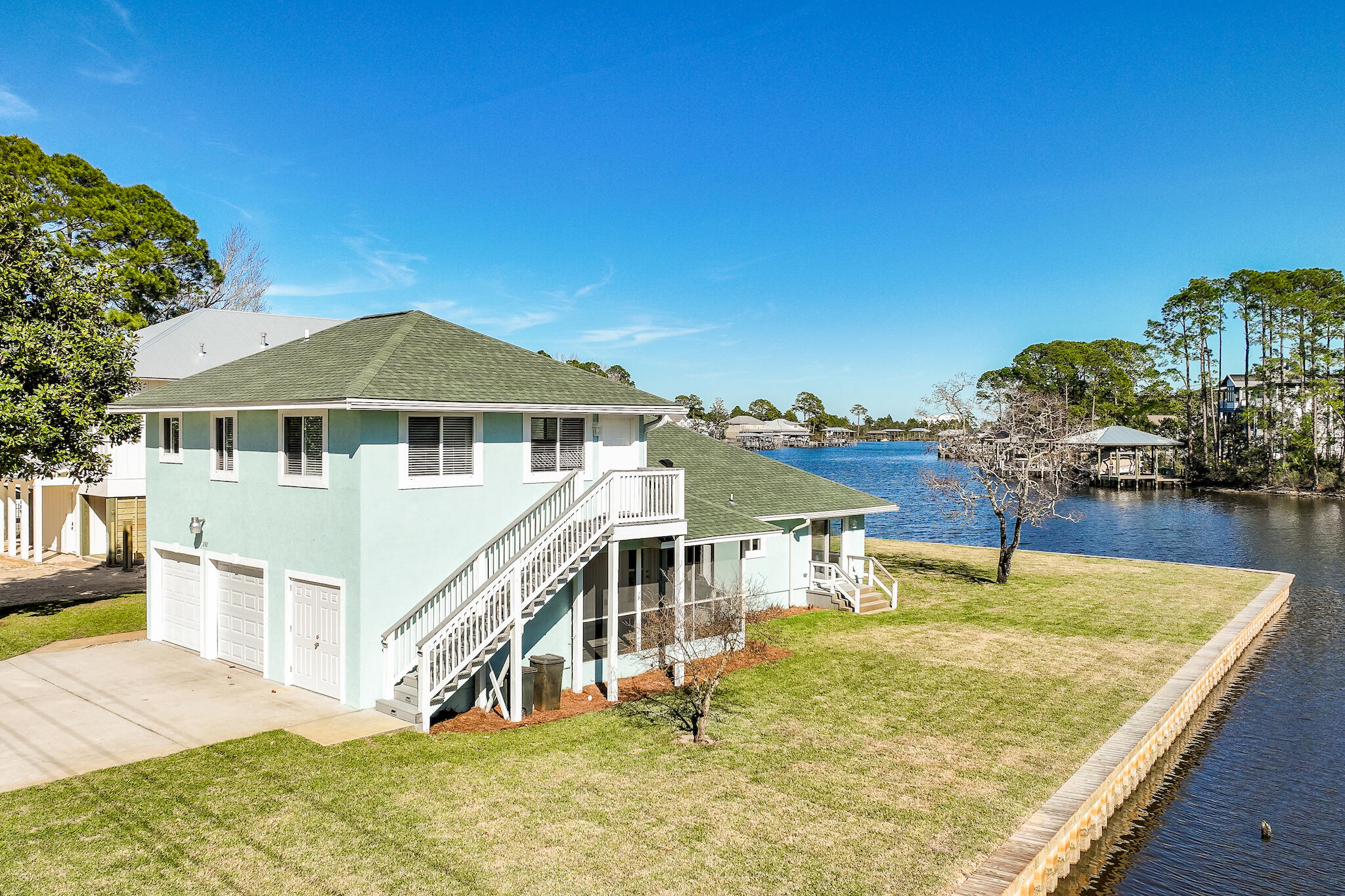292 West Harborview Road Santa Rosa Beach, FL 32459 - Photo 1 of 43 a house with trees in the background