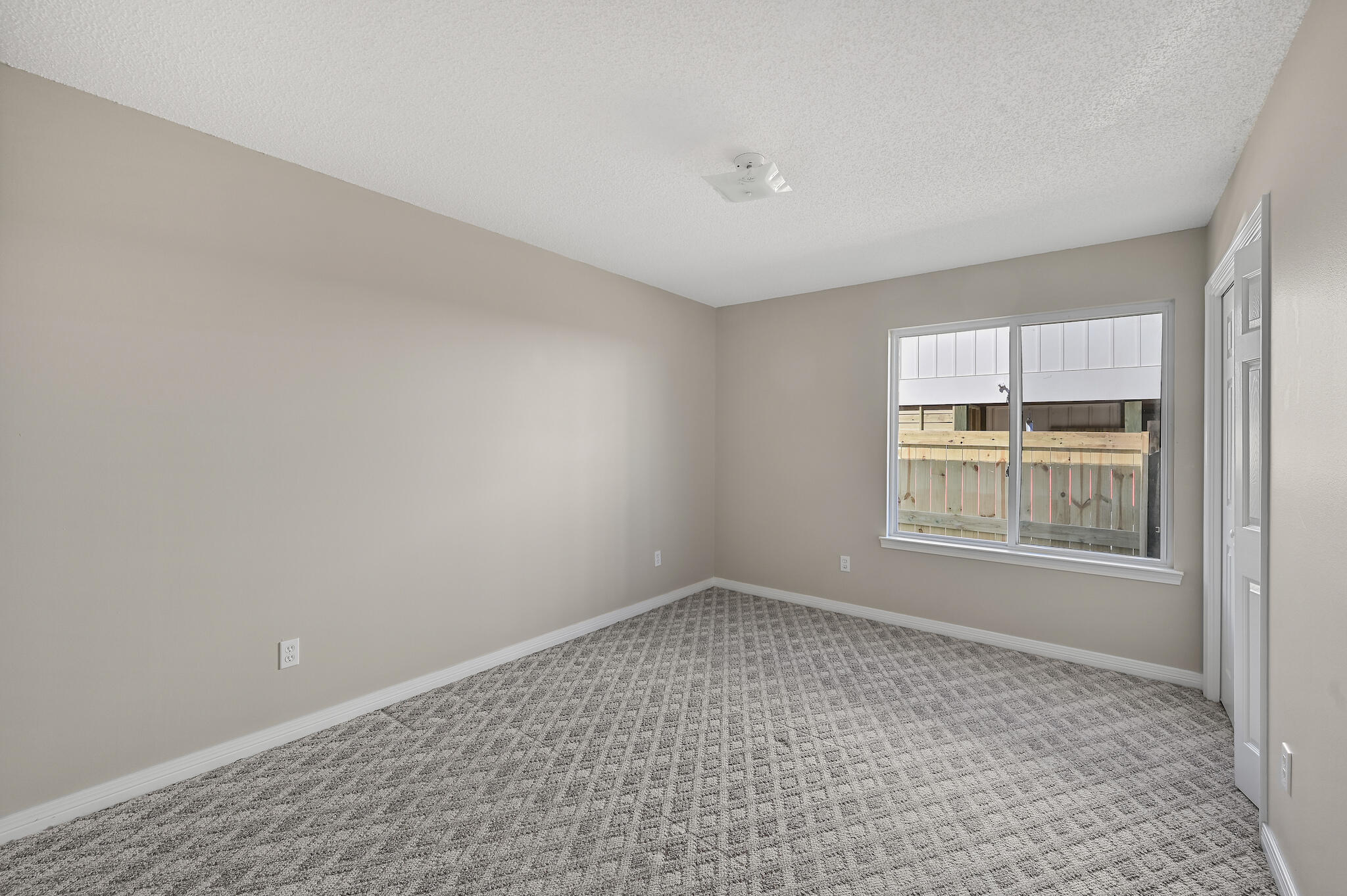 292 West Harborview Road Santa Rosa Beach, FL 32459 - Photo 16 of 43 an empty room with a window